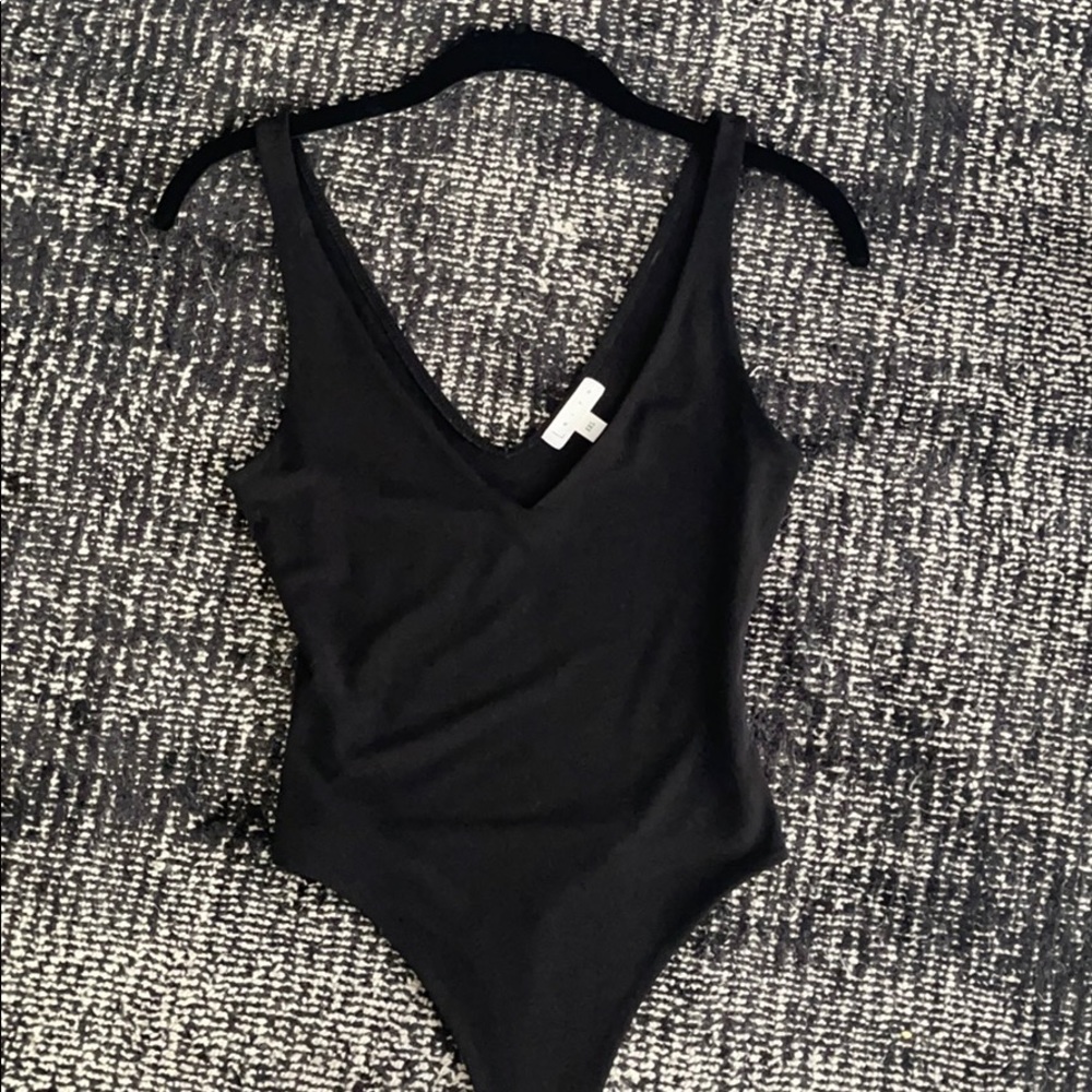 Black low neck body suit size xxs